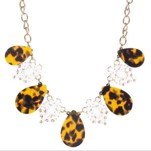 White Flora and Black Tortoise Lucite Necklace